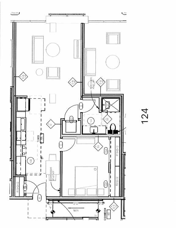 A floor plan of a house with a kitchen, living room, and bathrooms.