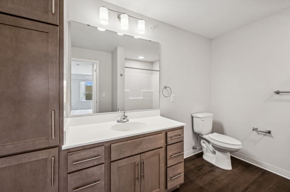 a bathroom with a toilet and a sink in it