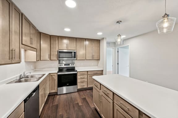 the preserve at ballantyne commons apartment kitchen with wood cabinets