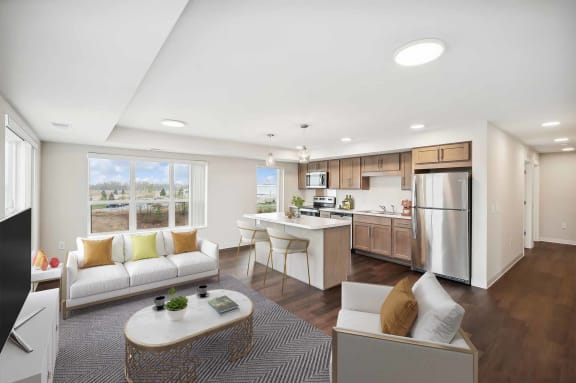 a living room and kitchen with a couch and a table