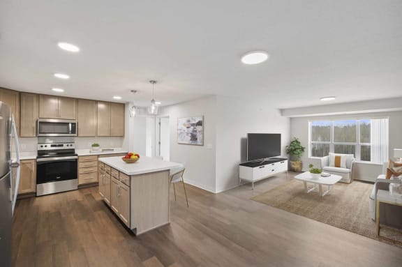 an open kitchen and living room with a table