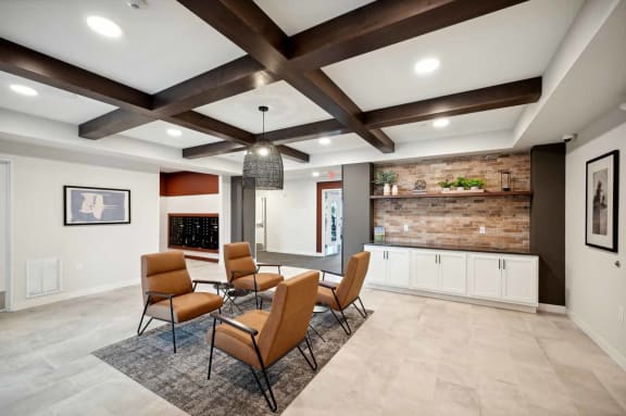 a living room with a table and chairs