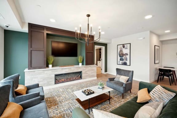 a living room with a fireplace and a tv