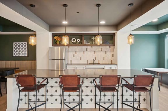 a large kitchen and dining area with chairs and a table