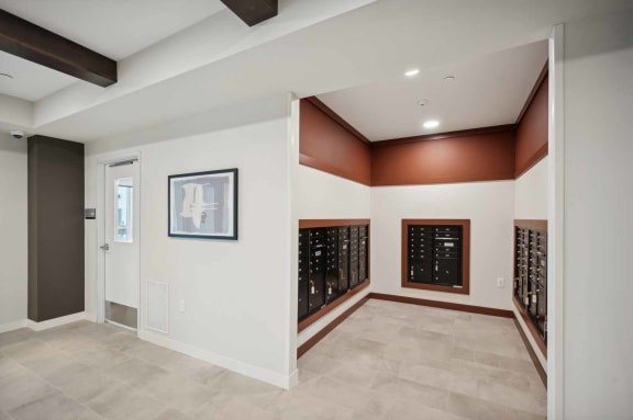 a tasting room with a wall of wine racks and a door to a cellar