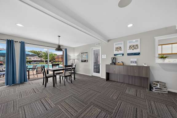 Community clubhouse with coworking lounge at Drawbridge Apartments in Harrison Township, MI.