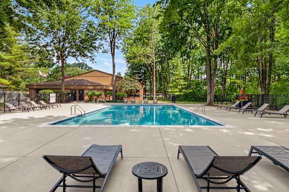Heated swimming pool and sundeck at Eastwood Village Apartments in Clinton Township, MI.