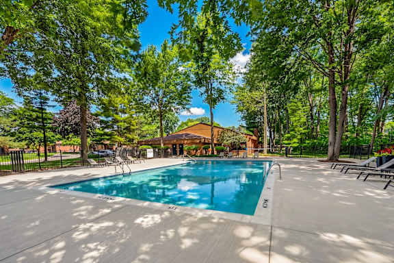 Heated swimming pool and sundeck at Eastwood Village Apartments in Clinton Township, MI.