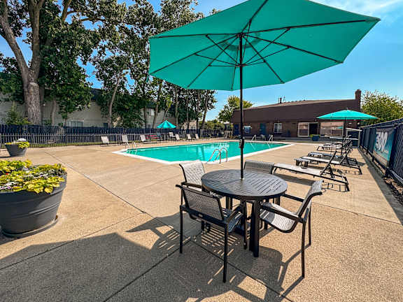 Heated swimming pool with sundeck at Knottingham Apartments in Clinton Township, MI.