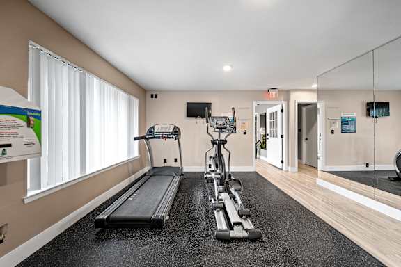 Updated 24-hour fitness and wellness center at Knottingham Apartments in Clinton Township, MI.