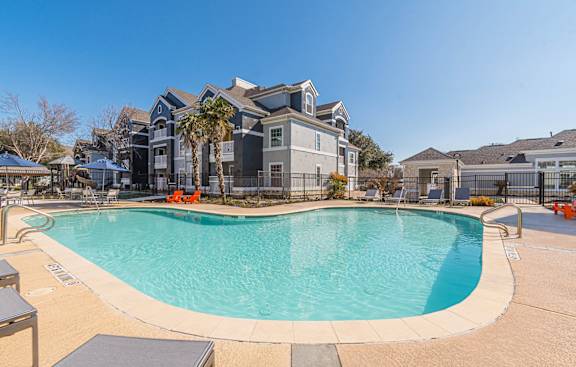 the preserve at ballantyne commons pool with apartment buildings in the background