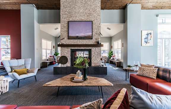 A living room with a fireplace and a television.