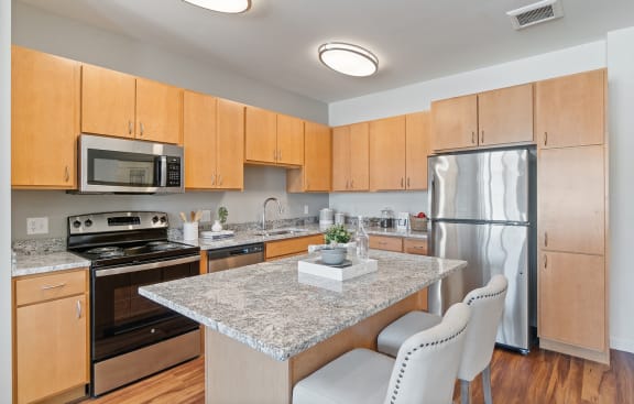 Fitted Kitchen With Island Dining at Harbor at Twin Lakes 55&#x2B; Apartments, Minnesota