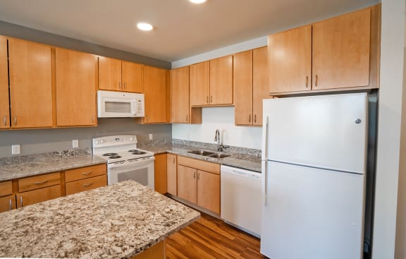 Wood cabinets at Heritage at Church Ranch 55+ Apartments, Westminster, CO, 80021