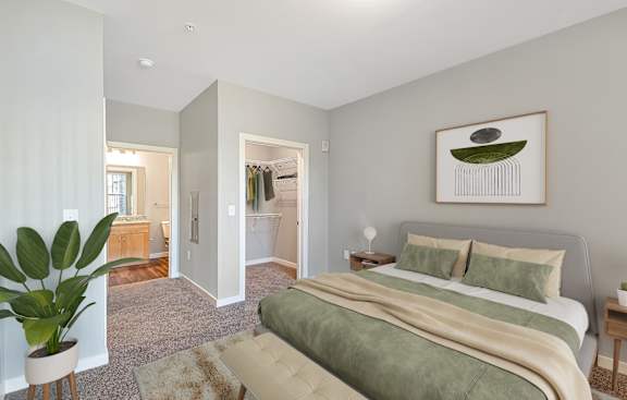 a bedroom with a bed and a bathroom with a closet