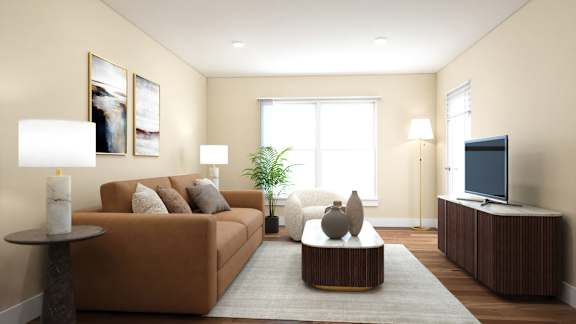 A living room with a brown couch, a coffee table, and a television.