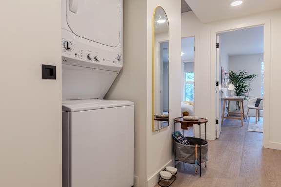A white oven and microwave in a modern kitchen.