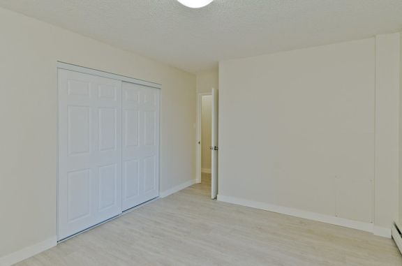A white garage door is closed.