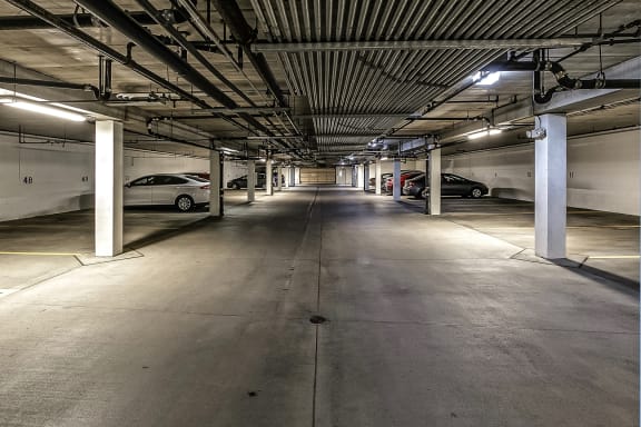 a parking garage with cars in it