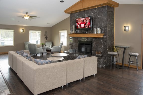 a living room with a couch and a fireplace