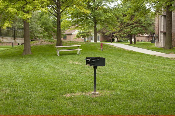 a mailbox in the grass in a park
