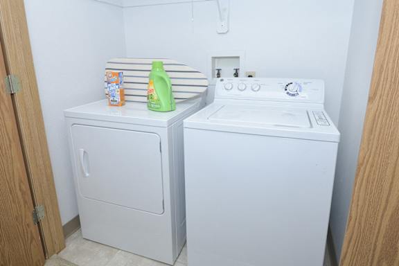 a small laundry room with a washer and dryer in it