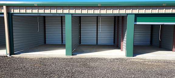 a set of three garage doors in front of a building
