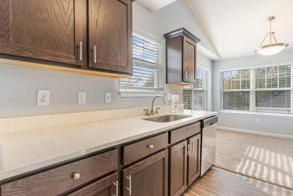 A kitchen with wooden cabinets and a white countertop.