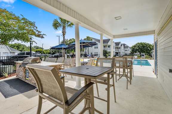 A patio with a table and chairs is shown.