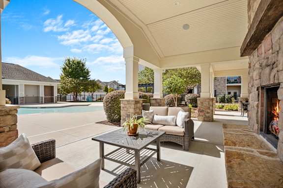 A patio with a table and chairs is shown.