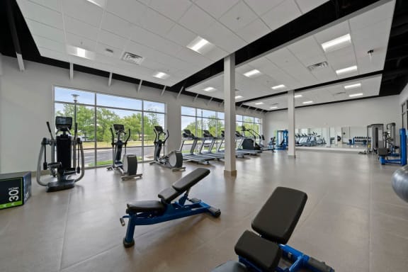 a gym with a bunch of exercise equipment in itat Metropolis Apartments, Glen Allen, VA 23060