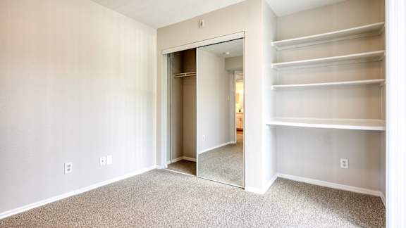 Bedroom closet with shelves at The Crest on Hampton Hollow, Silver Spring, MD, 20904