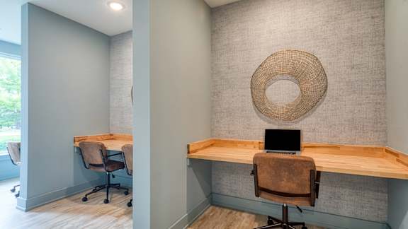 A room with a desk and a chair.