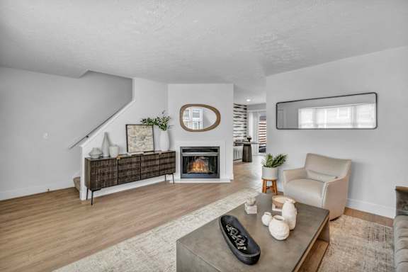 A living room with a fireplace and a couch.