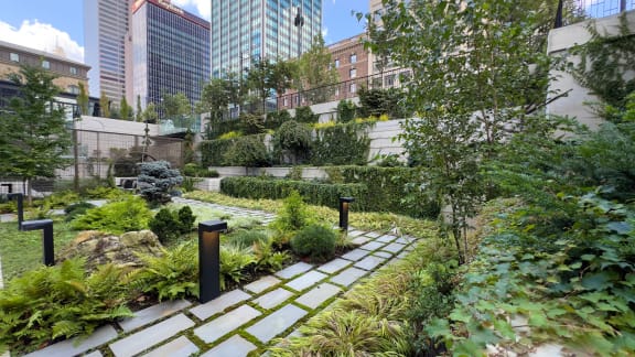 a garden with buildings in the background at Preston Centre, Columbus, Ohio, 43215