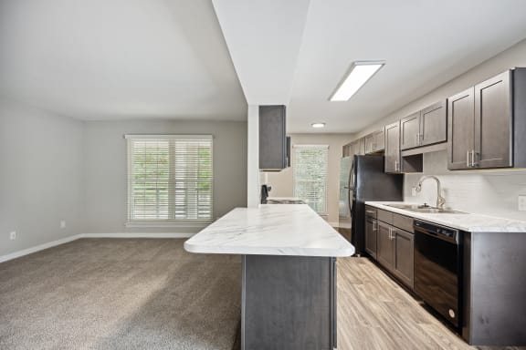 a kitchen with black appliances and a marble counter top at Shellbrook, Raleigh, NC, 27609