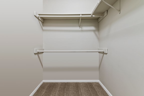 a spacious walk in closet in a 555 waverly unit