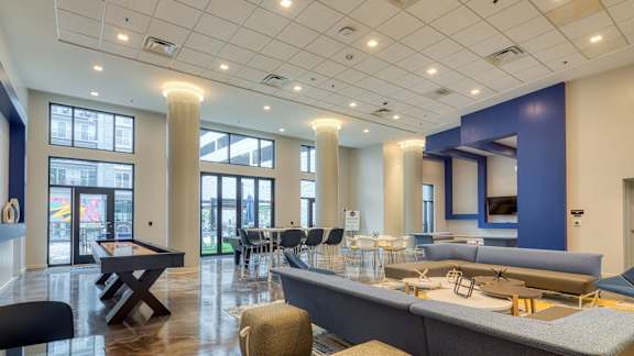 A spacious room with a pool table and a bar area at Mosaic Summit Pointe in Chesapeake, 23320