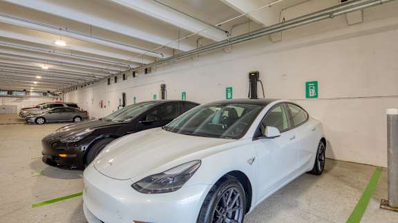 A white car is parked in a parking garage at Mosaic Summit Pointe in Chesapeake, VA, 23320