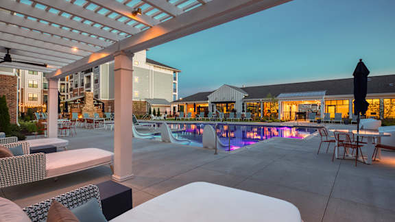 A poolside area with loungers and a bar.