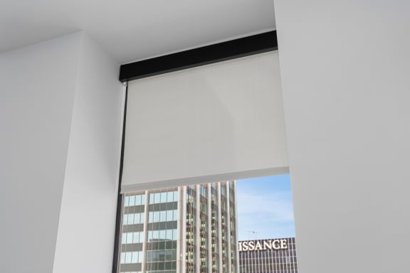 a white motorised blind in a window at Preston Centre, Columbus