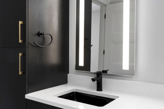 a small bathroom with a sink and a mirror at Preston Centre, Columbus