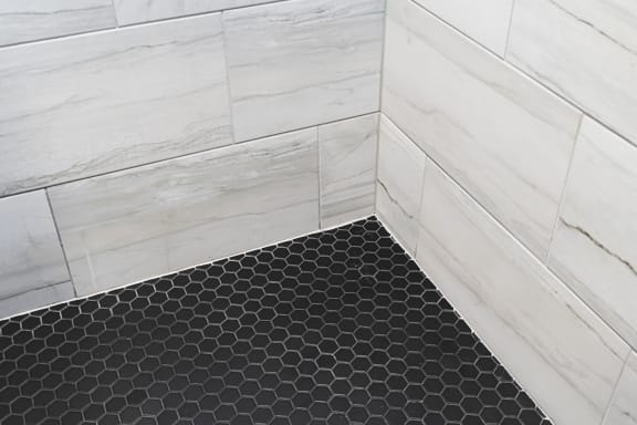 a close up of the black and white subway tile in the shower at Preston Centre, Columbus, 43215