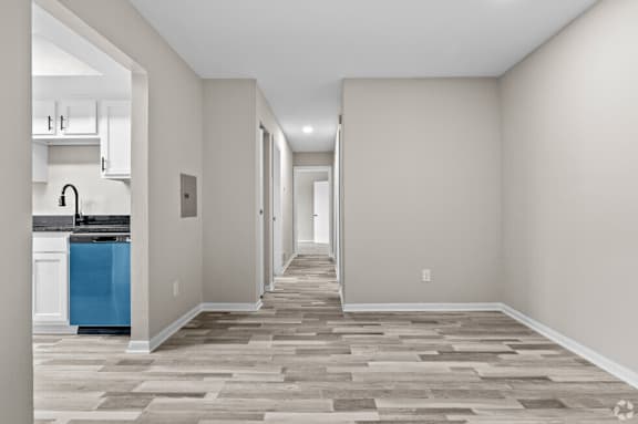 a renovated living room and kitchen in a new home at Bayville Apartments, Virginia, 23455