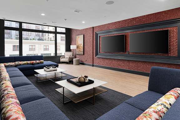 A living room with a long sofa and a coffee table.