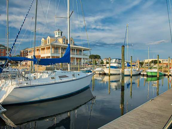 a group of boats are docked in a marina at The Port at East Beach Apartments and Marina, Virginia, 23518
