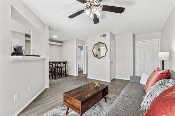 Open concept living and dining area with vaulted ceiling at Polo Club Apartments, Texas, 78729