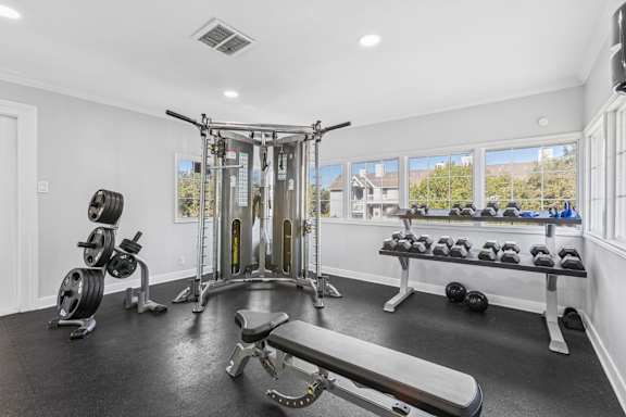 Fitness center with cable machine and free weights at Polo Club Apartments, Austin, TX