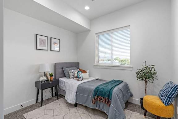 bedroom with a bed and a window