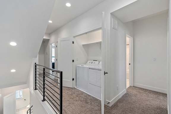 a hallway with a laundry closet with washer and dryer